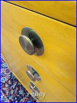 Rare Mid Century Modern Four Drawer Dresser with Iconic Round Brass Drawer Pulls Rare Mid Century Modern Four Drawer Dresser with Iconic Round Brass Drawer Pulls